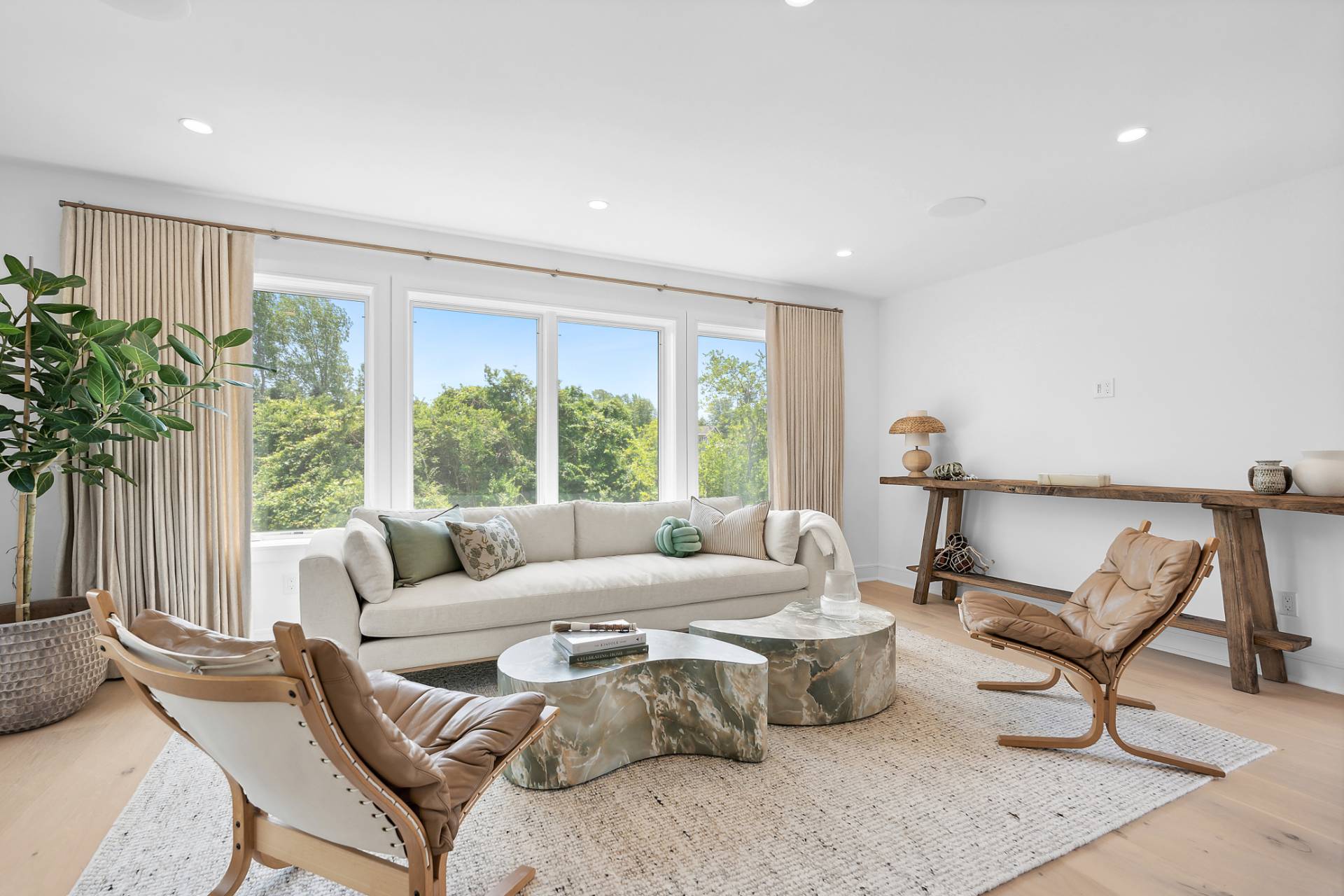 55 Fairview Avenue Montauk, NY 11954 - Photo 5 of 22 a living room with furniture and a large window