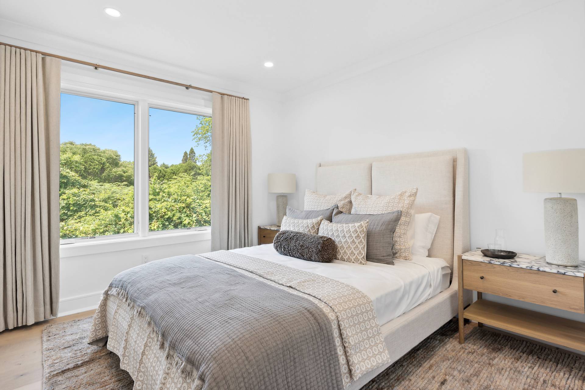 55 Fairview Avenue Montauk, NY 11954 - Photo 9 of 22 a bedroom with a large bed and a large window