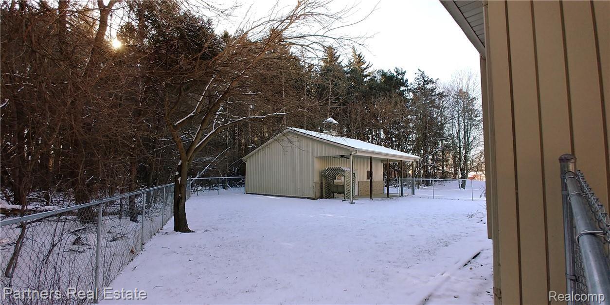 1701 West Cohoctah Road Howell, MI 48855 - Photo 4 of 50 Fenced Backyard with Outbuilding.jpg
