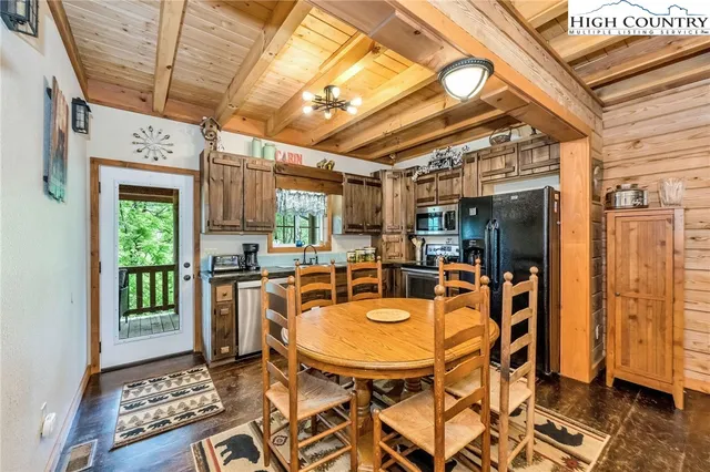 a kitchen with a sink a counter top space and cabinets