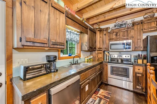 a outdoor space with patio furniture and kitchen view