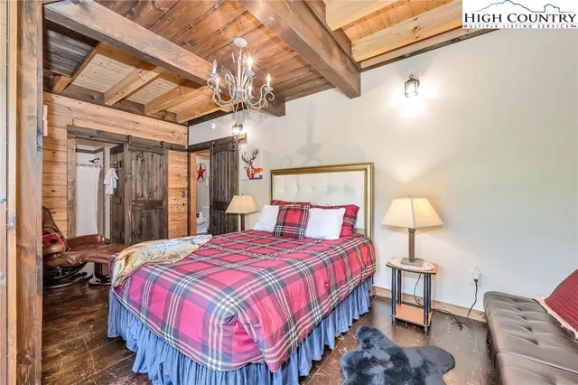 a bed room with a bed and a window