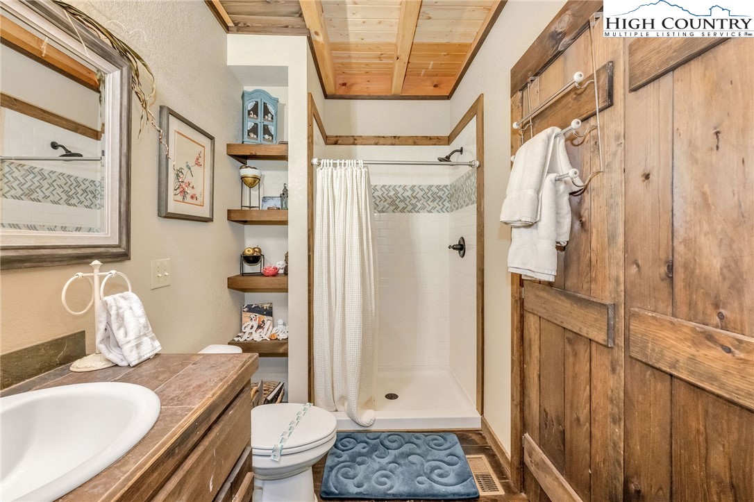 218 Cherokee Circle Jefferson, NC 28640 - Photo 28 of 50 a bathroom with a sink toilet and shower