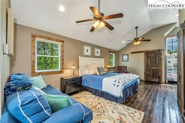 a bathroom with a double vanity sink mirror and toilet
