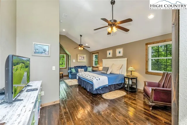 a bathroom with double vanity sinks and a mirror