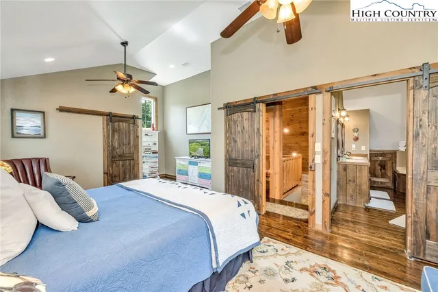 a bedroom with furniture and a chandelier