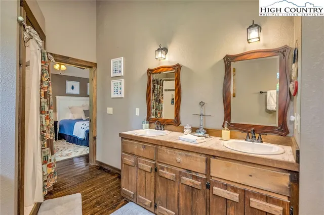 a bed room with a bed and a flat screen tv