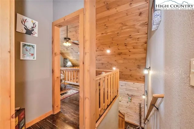 a view of a dining room with furniture a livingroom and chandelier