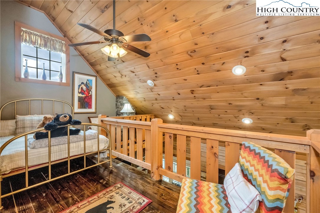 218 Cherokee Circle Jefferson, NC 28640 - Photo 36 of 50 a bedroom with furniture and a chandelier