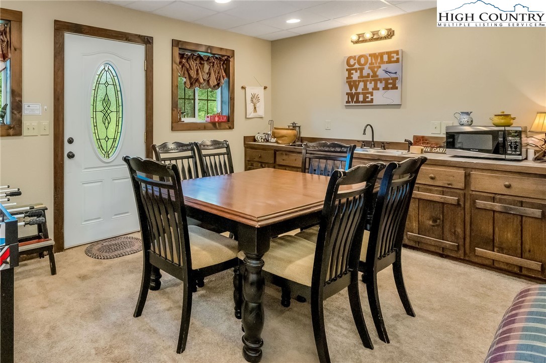 218 Cherokee Circle Jefferson, NC 28640 - Photo 40 of 50 a view of a dining room with furniture and a window