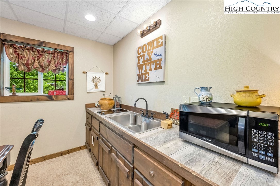 218 Cherokee Circle Jefferson, NC 28640 - Photo 41 of 50 a kitchen that has a sink and a stove
