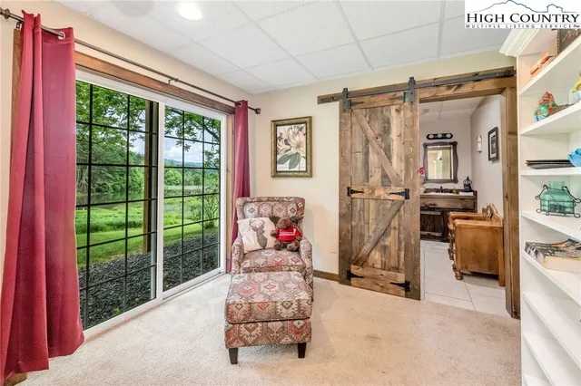 an empty room with fan and windows