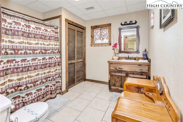 a view of a lake with a house in the background