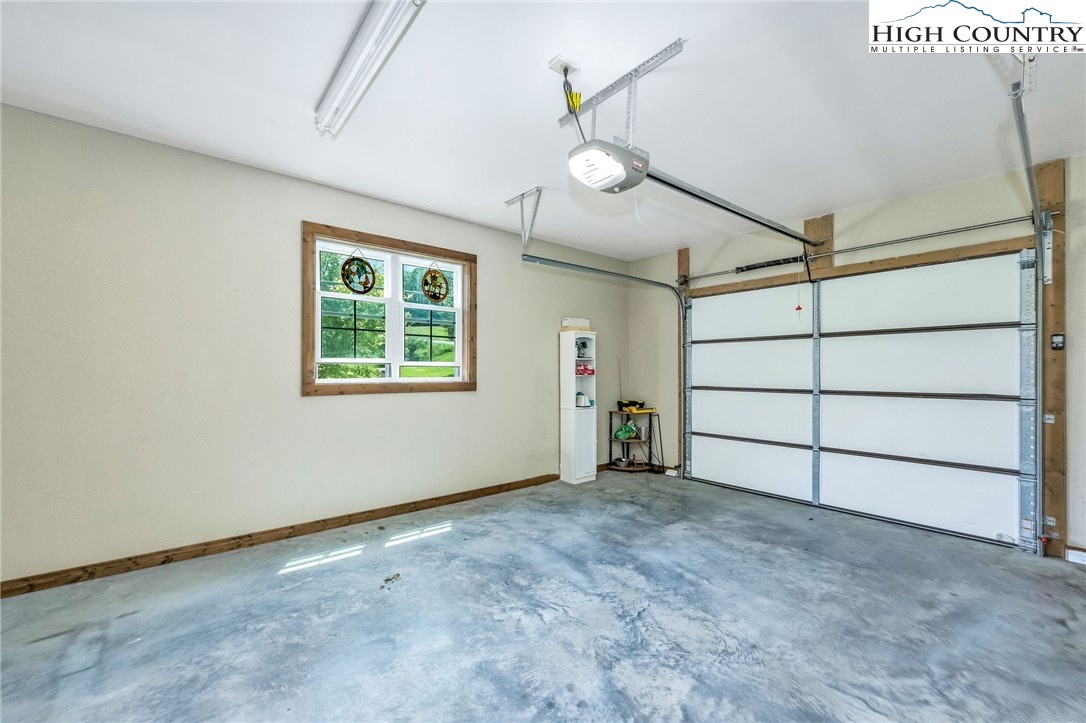 218 Cherokee Circle Jefferson, NC 28640 - Photo 47 of 50 an empty room with fan and windows