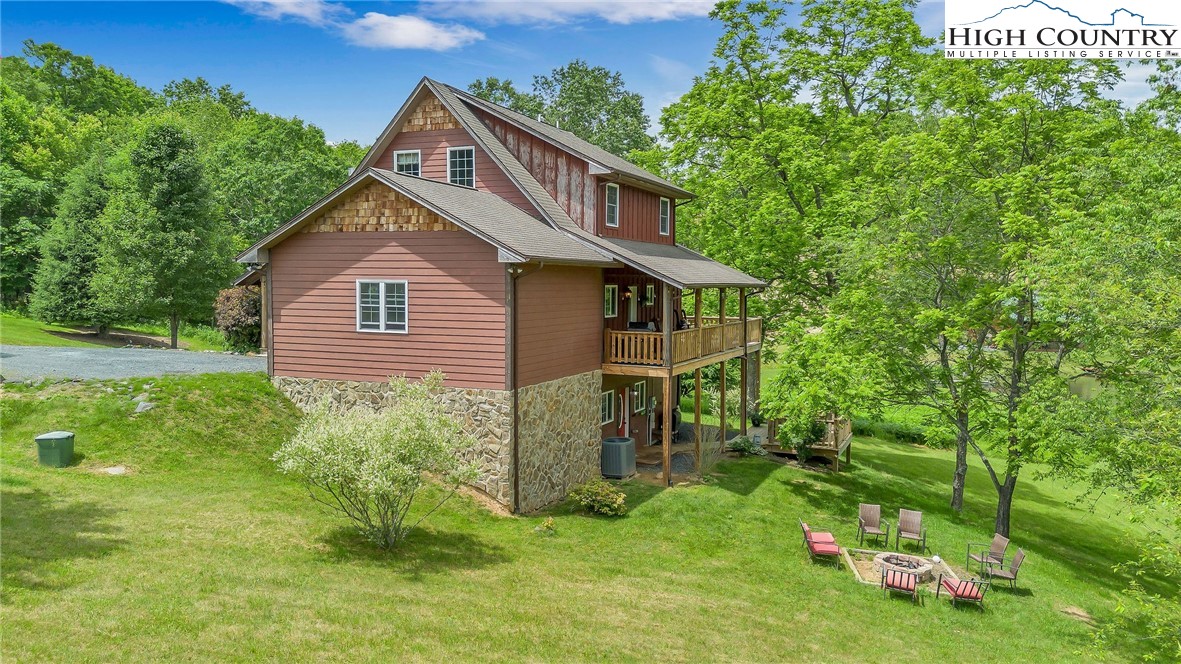 218 Cherokee Circle Jefferson, NC 28640 - Photo 5 of 50 a front view of a house with a yard