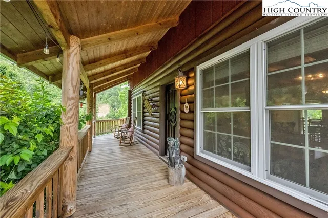a view of balcony with couch and chairs