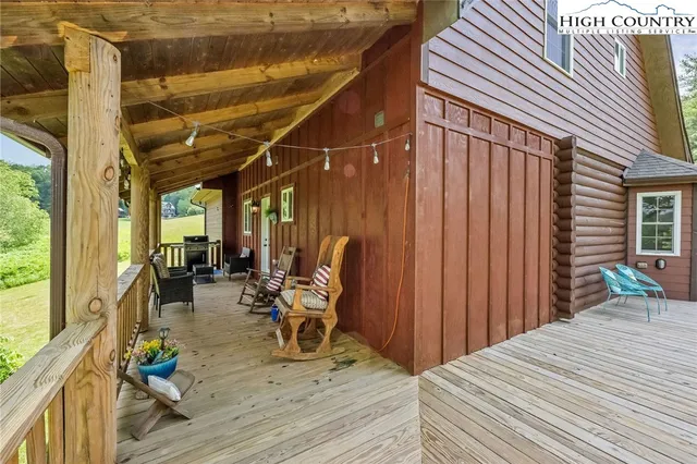 a living room with furniture a fireplace and a table