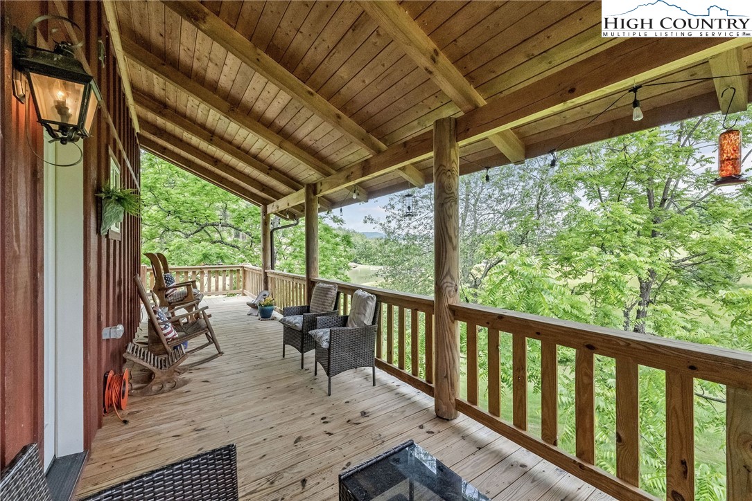 218 Cherokee Circle Jefferson, NC 28640 - Photo 10 of 50 a view of balcony with couch and chairs