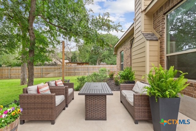3306 Spring Canyon Road Belton, TX 76513 - Photo 34 of 40 a view of a patio with couches table and chairs and potted plants