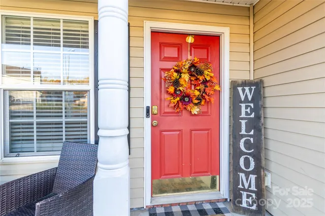 a view of a door and a red umbrella