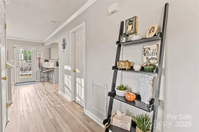 a view of living room with furniture and wooden floor