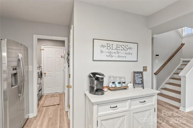 a view of bathroom with a sink mirror and shower