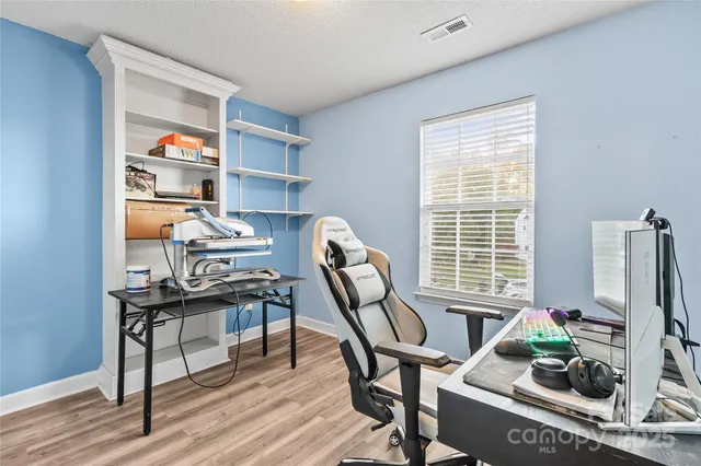 a work room with furniture and a window