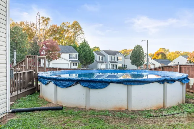 a view of balcony with two chairs and a table