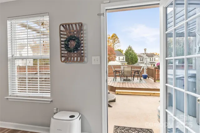 a picture of a glass door with a view of swimming pool
