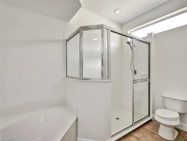 a bathroom with a shower and a toilet