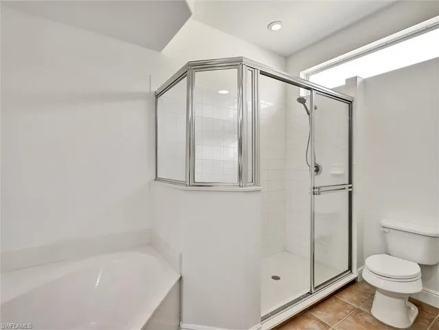 a bathroom with a shower and a toilet