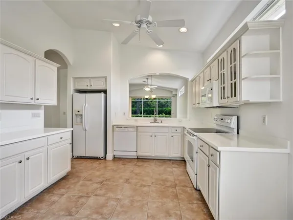a kitchen with sink cabinets and window