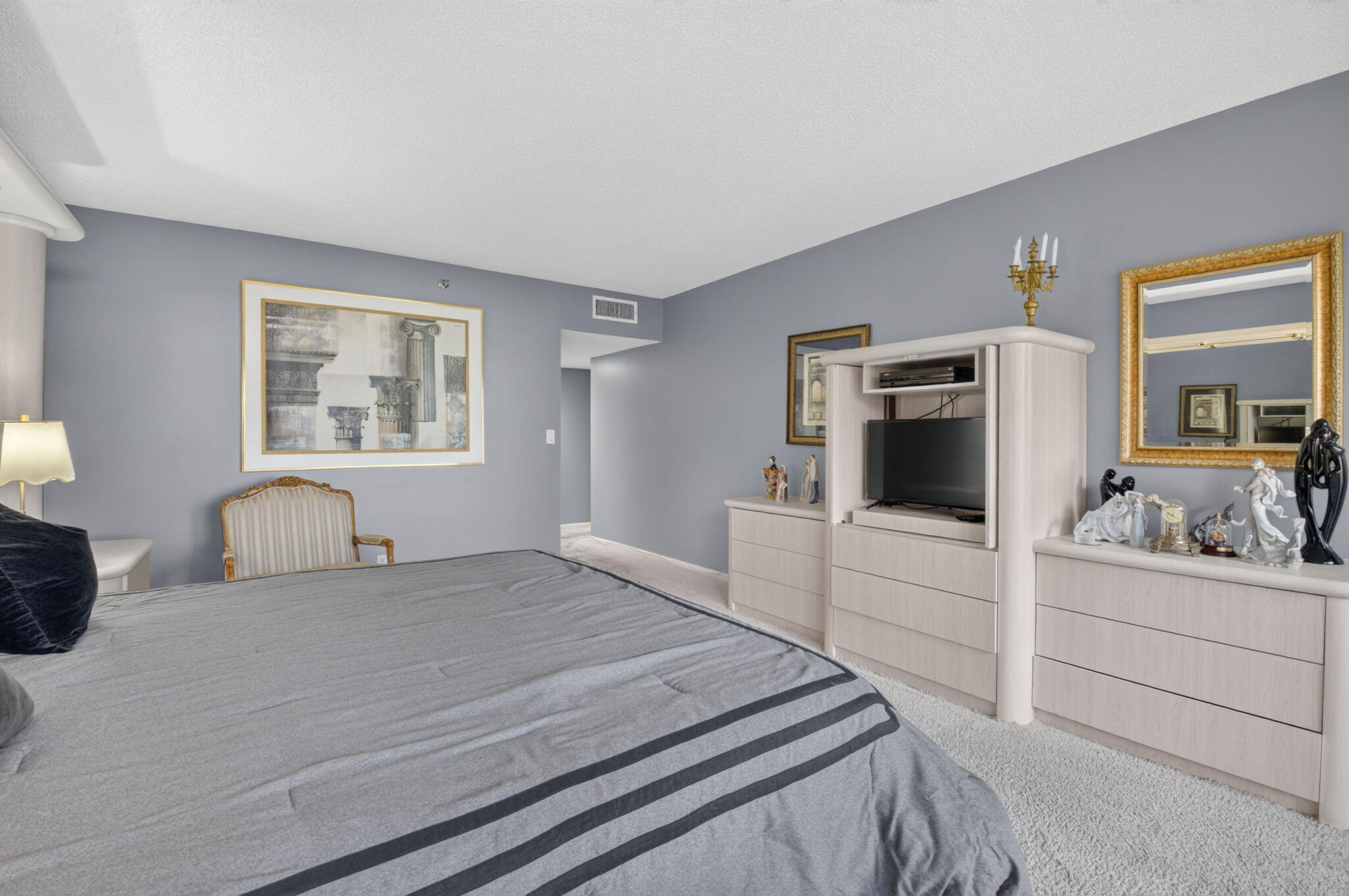1401 South Ocean Boulevard, Unit 1060 Boca Raton, FL 33432 - Photo 18 of 46 a bedroom with a bed and a large window
