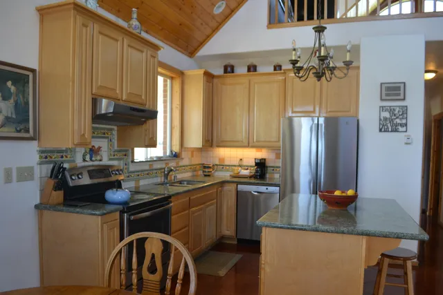 a view of walk in closet with wooden floor