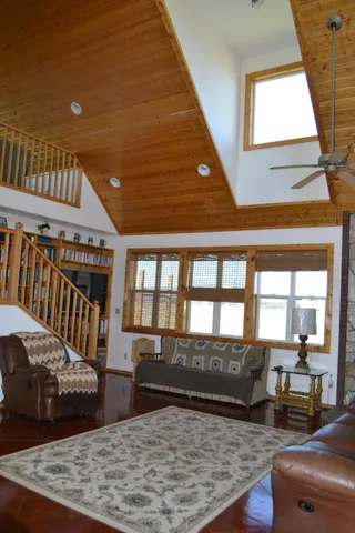 a bathroom with a granite countertop sink and mirror