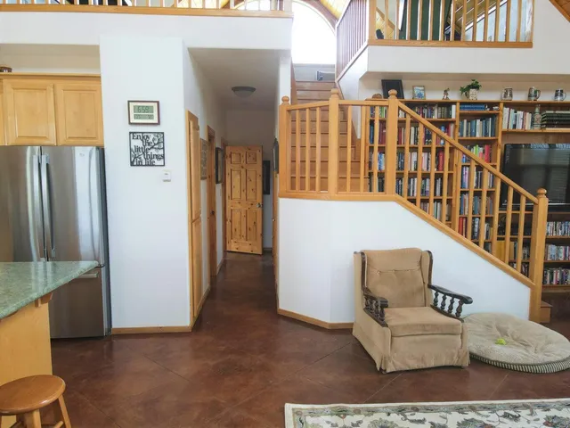 a view of a house with a yard and a forest