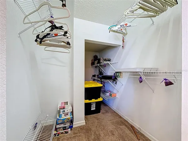 a view of storage and utility room with a window