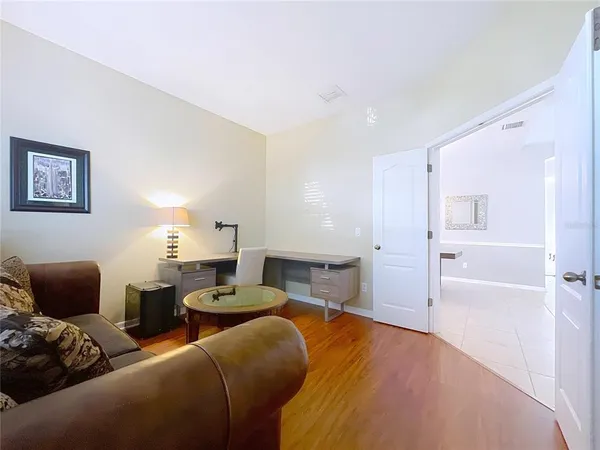 a bedroom with furniture and a rug