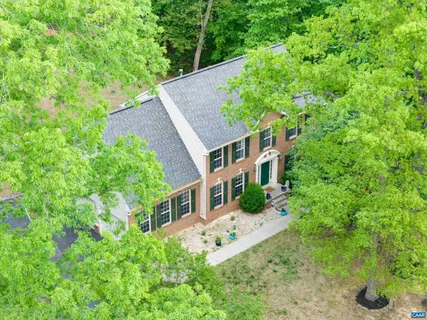 front view of a house with a tree