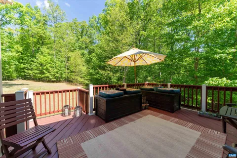 a view of a sitting area with furniture and backyard