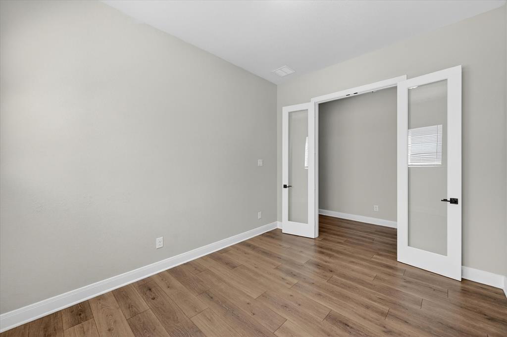 2237 Pika Road Northlake, TX 76247 - Photo 32 of 37 Office featuring wood-finish flooring, light gray walls, and white baseboards