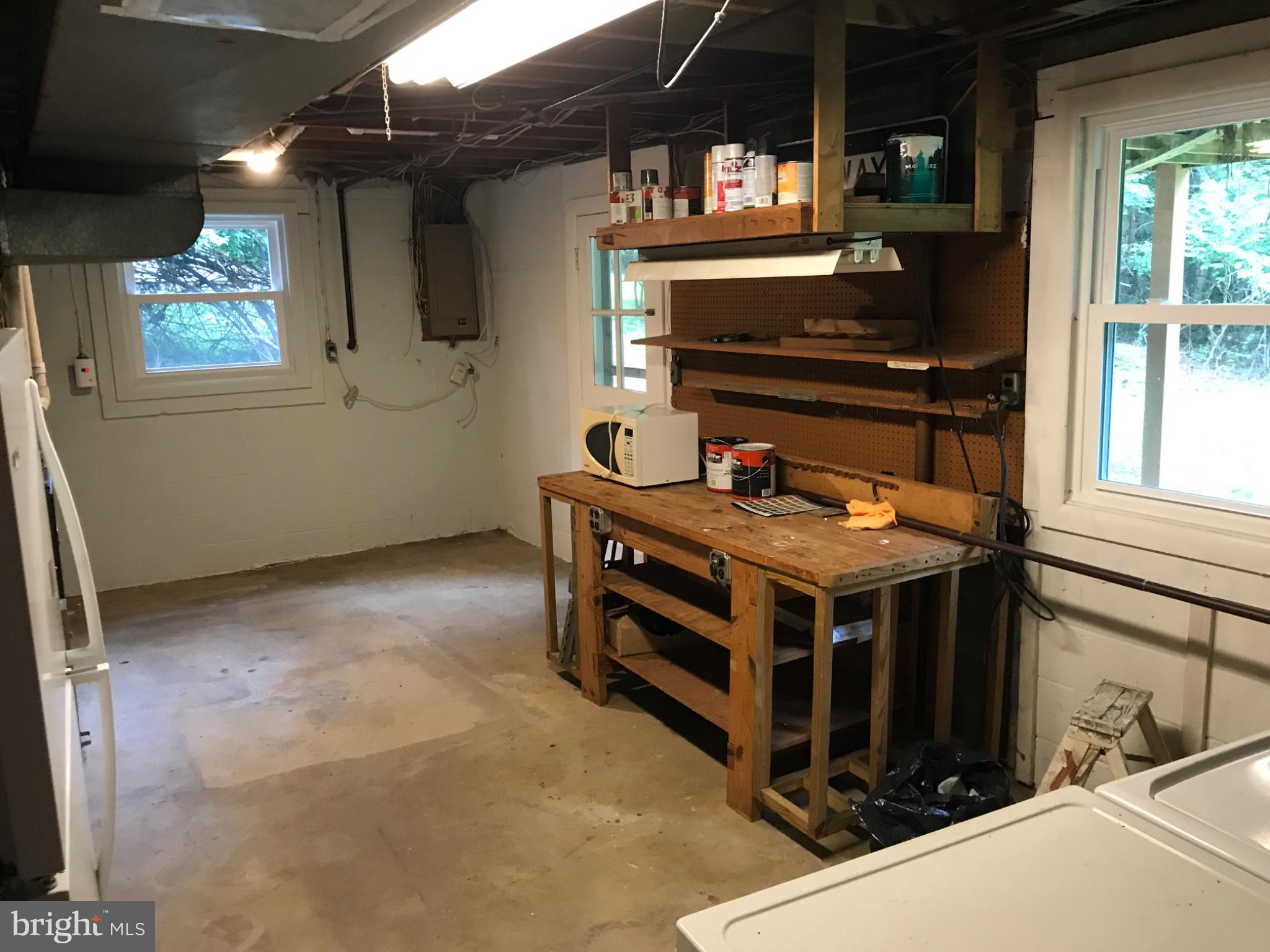 113 Kingsley Road Southwest Vienna, VA 22180 - Photo 28 of 40 Spacious workshop with natural light.
