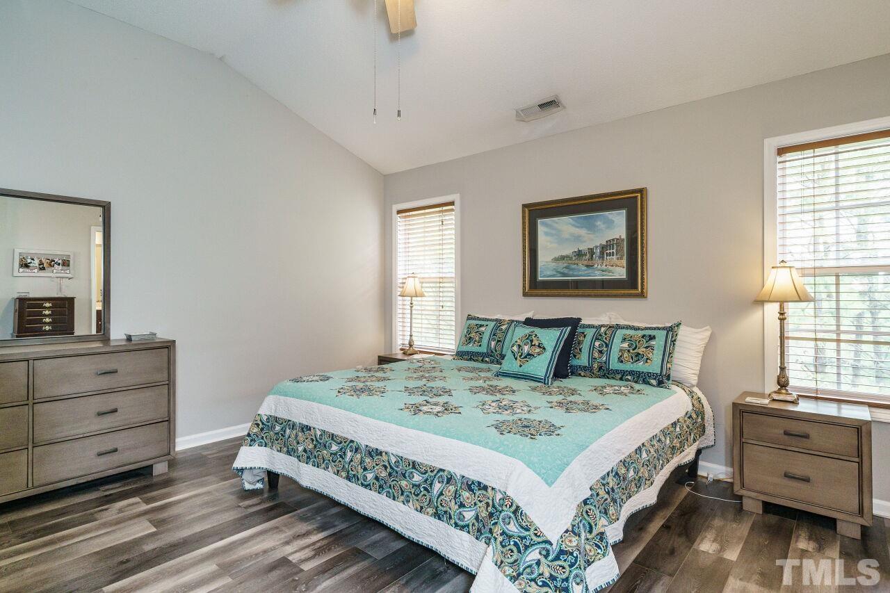 6903 Middleboro Drive Raleigh, NC 27612 - Photo 16 of 26 a bed sitting in a bedroom next to a window
