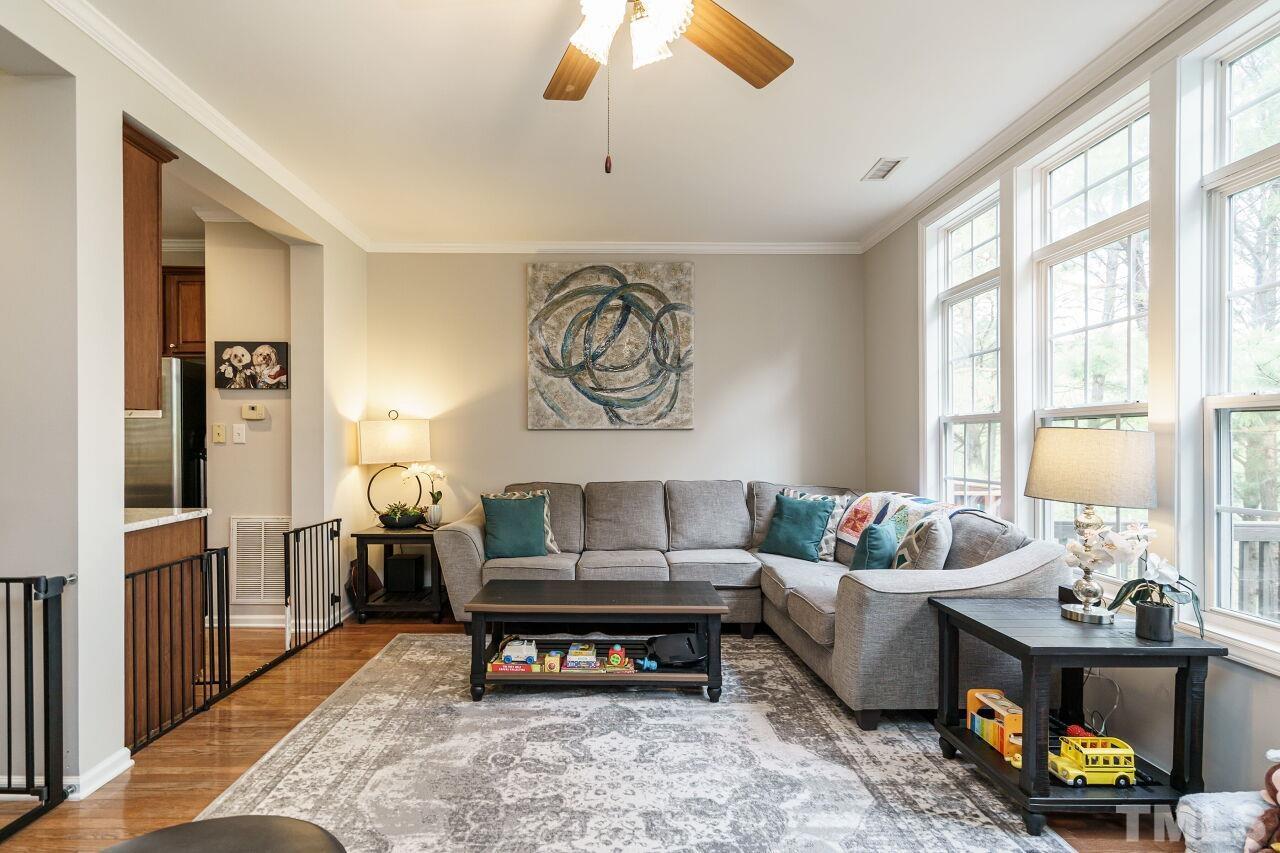 6903 Middleboro Drive Raleigh, NC 27612 - Photo 5 of 26 a living room with furniture and a large window