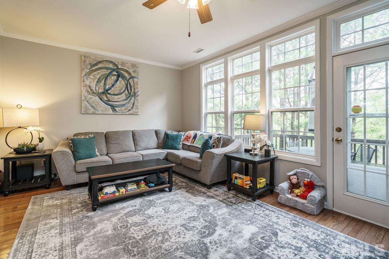 6903 Middleboro Drive Raleigh, NC 27612 - Photo 6 of 26 a living room with furniture and a large window