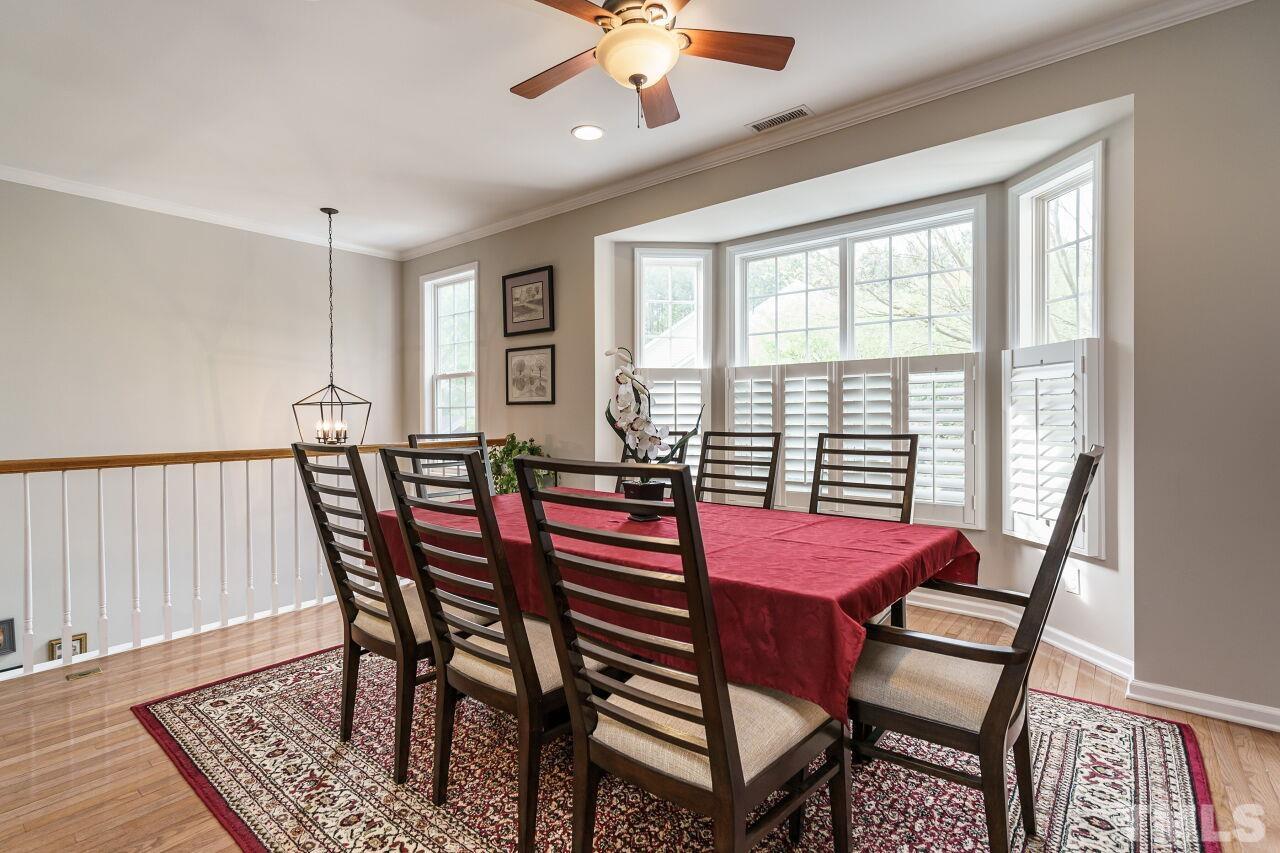 6903 Middleboro Drive Raleigh, NC 27612 - Photo 10 of 26 a view of a dining room with furniture and a window