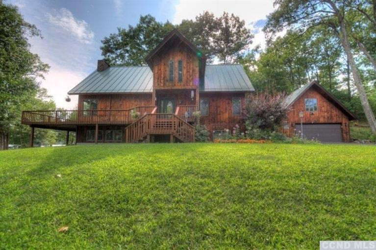 33 Golf Course Road Copake, NY 12521 - Photo 2 of 10 a front view of a house with garden