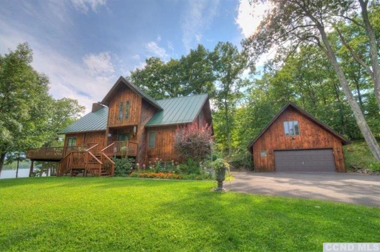 33 Golf Course Road Copake, NY 12521 - Photo 3 of 10 a front view of a house with garden