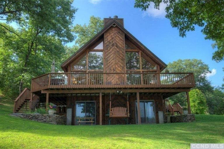33 Golf Course Road Copake, NY 12521 - Photo 4 of 10 a view of a house with garden and trees