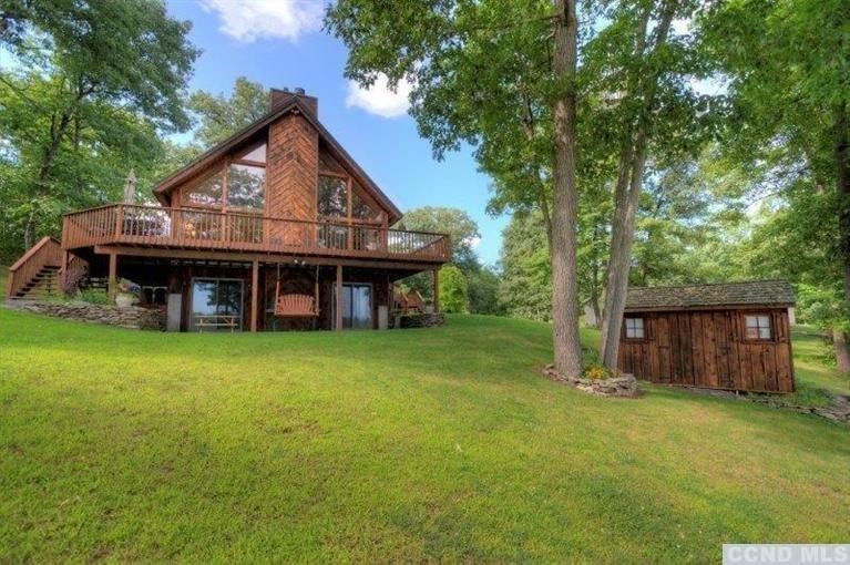 33 Golf Course Road Copake, NY 12521 - Photo 5 of 10 a view of a house with a yard and large tree